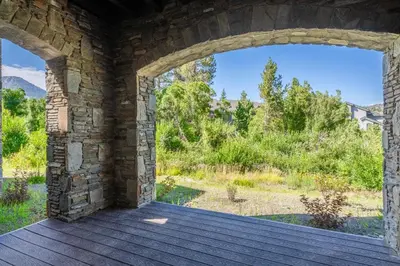 an entrance to a stone building with an archway at Creekhouse 1583 in Mammoth Lakes
