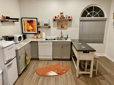 a kitchen with a sink and a counter top at Foxs Den Hot Tub Bbq Queen Bed Sleeps 2 in Ahwahnee