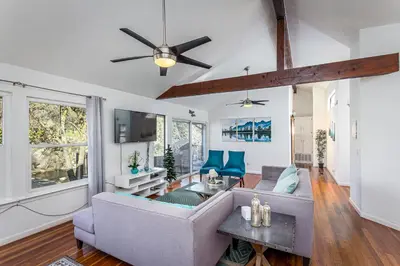 a living room with a couch and a ceiling fan at **Kaweah River House** - 1/2 Mile to Sequoia Park in Three Rivers