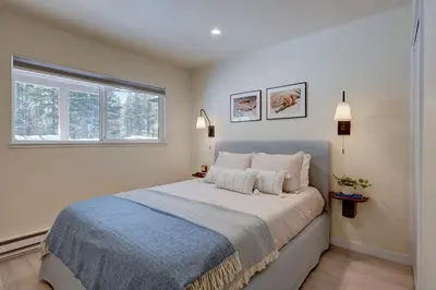 a bedroom with a large bed and a window at Luxury Tahoe Getaway in Incline Village in Incline Village