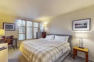 a bedroom with a large bed and a window at St Moritz 55 F in Mammoth Lakes