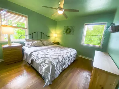 a bedroom with a bed and a ceiling fan at Sweet Home with Ample Parking Only 2mins to Freeway in Sacramento