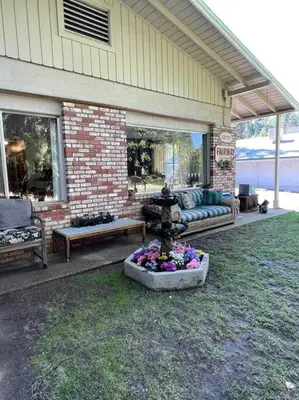 a patio with a fountain in the middle of a yard at Fairway Apartments Unit 1 in Twain Harte