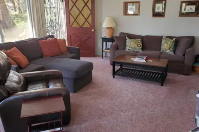 a living room with couches and a coffee table at Fairway Apartments Unit 1 in Twain Harte