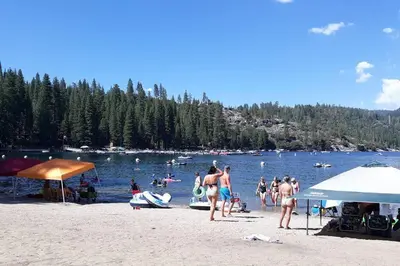a group of people on a beach near the water at Fairway Apartments Unit 1 in Twain Harte