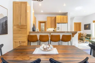 a kitchen and dining room with a table and chairs at Bright 3BD Kings Beach Townhome in Kings Beach