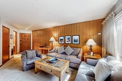 a living room with two couches and a coffee table at Sierra Park Villas 39 H in Mammoth Lakes
