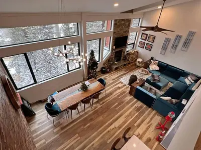 an overhead view of a living room with a couch and a table at Gondola Chalet -New Luxury 5 Bdrm Condo @ Canyon Lodge, Steam Room in Mammoth Lakes