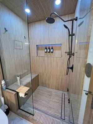a shower with a glass door in a bathroom at Gondola Chalet -New Luxury 5 Bdrm Condo @ Canyon Lodge, Steam Room in Mammoth Lakes