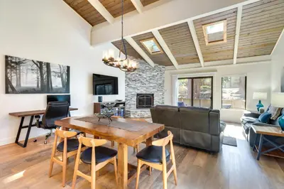 a dining room and living room with a table and chairs at Stylish Incline Village Vacation Rental with AandC! in Incline Village