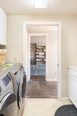a washer and dryer in a room with a hallway at Murphys Wine Country Getaway in Murphys