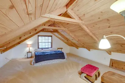 a bedroom with a bed and a wooden ceiling at Hike, Boat and Ski South Lake Tahoe Home in South Lake Tahoe