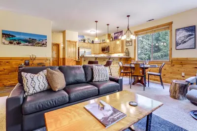 a living room with a couch and a table at Boulders Truckee Condo Near Donner Lake and Skiing! in Truckee