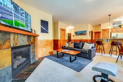 a living room with a couch and a fireplace at Boulders Truckee Condo Near Donner Lake and Skiing! in Truckee