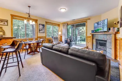 a living room with a couch and a fireplace at Boulders Truckee Condo Near Donner Lake and Skiing! in Truckee