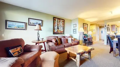 a living room with couches and a table at Bridges #108 condo in Mammoth Lakes