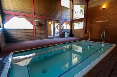 a large swimming pool in a house at Bridges #108 condo in Mammoth Lakes