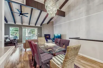 a living room with a dining table and chairs at Mountain Shadows in Incline Village