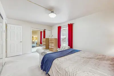 a bedroom with a bed and red curtains at Mountain Shadows in Incline Village