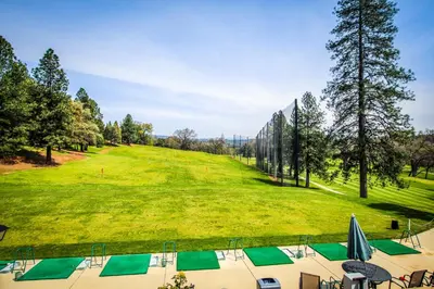 a view of a golf course with a green field at Jordan Oak in Groveland