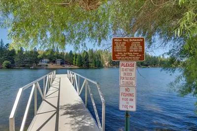 a bridge over a body of water with two signs at Jordan Oak in Groveland