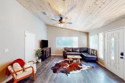 a living room with a couch and a table at Jordan Oak in Groveland