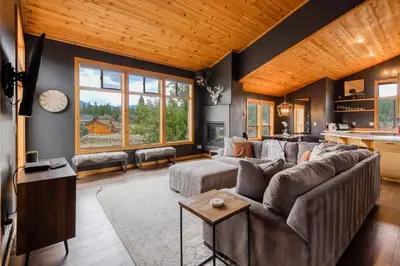 a living room with a couch and a table at The Modern Moose Lodge in Truckee