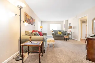 a living room with a couch and a table at Longer Stays for Travelers- Apt Blocks from Hospital, Downtown in Visalia