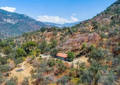 an aerial view of a house on a mountain at Scenic Spanish Rancho - Breathtaking Views in Three Rivers