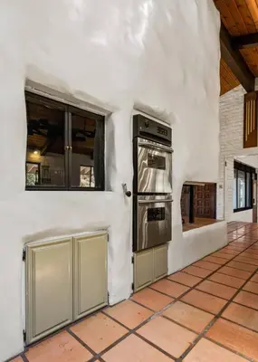 a kitchen with an oven in a white wall at Scenic Spanish Rancho - Breathtaking Views in Three Rivers