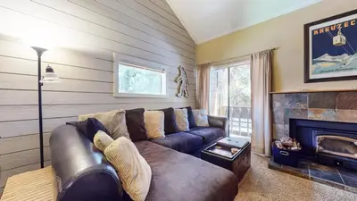 a living room with a couch and a fireplace at La Residence V #T05 condo in Mammoth Lakes