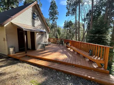 a large wooden deck in front of a house at Sequoia National Forest CabinD in Panorama Heights
