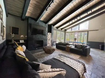 a living room with a couch and a fireplace at Chamonix #64 condo in Mammoth Lakes