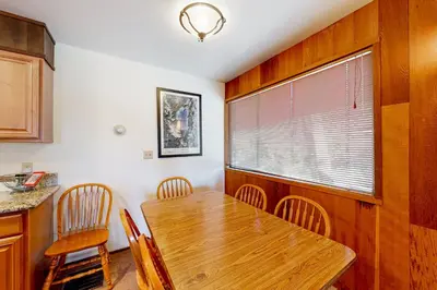 a dining room with a wooden table and chairs at Serene Escape in Kings Beach