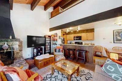 a living room with a couch and a table at Serene Escape in Kings Beach