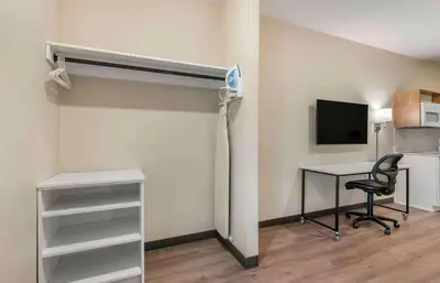 a room with a bed and a desk and a computer at Extended Stay America Premier Suites - Reno - Sparks in Sparks