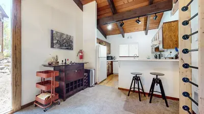 a kitchen with white walls and wooden ceilings at Lakeview Lodge #2 condo in Mammoth Lakes