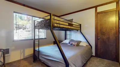 a bedroom with a bunk bed and a window at Lakeview Lodge #2 condo in Mammoth Lakes