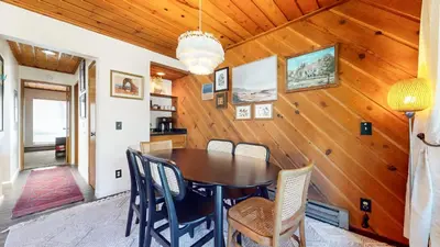 a dining room with a table and chairs at Courchevel #5 condo in Mammoth Lakes