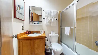 a bathroom with a toilet and a sink and a shower at Courchevel #5 condo in Mammoth Lakes