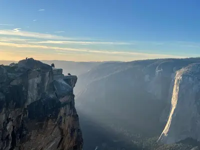 a person standing on the edge of a mountain at Stewart Chalet @ Yosemite/Bass Lake in Bass Lake