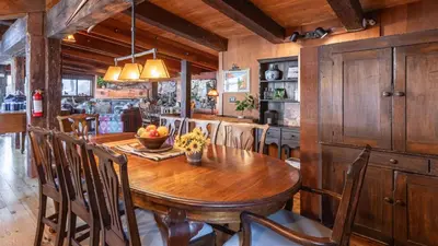 a dining room with a wooden table and chairs at Mt. Jola by AvantStay A 5-minute walk away to Palisades and lifts. in Olympic Valley