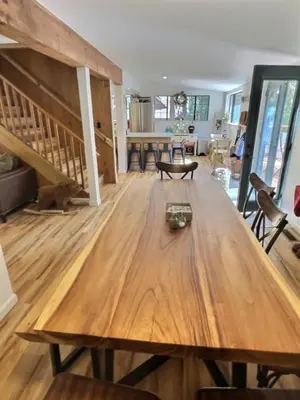 a large wooden table in a living room at Walking Distance To The Lake And Beach! in Kings Beach