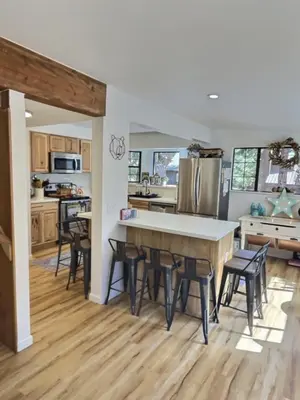 a kitchen with a table and some chairs in it at Walking Distance To The Lake And Beach! in Kings Beach