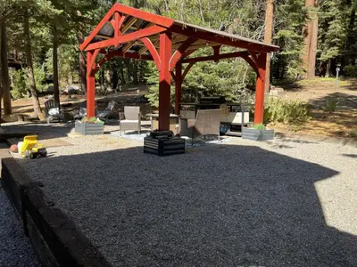 a pavilion with an orange structure in a park at Walking Distance To The Lake And Beach! in Kings Beach