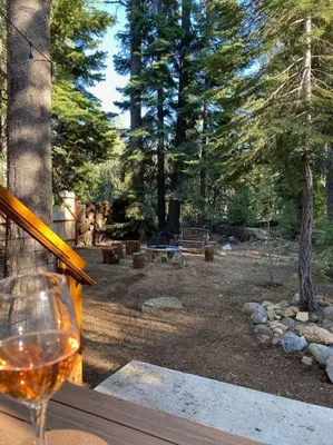 a glass of wine sitting on top of a table at FamilyfunCabin in Tahoma