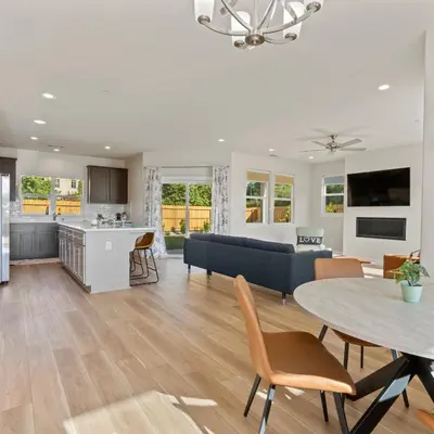 a kitchen and living room with a table and chairs at Newly Built Murphys Modern Retreat in Murphys