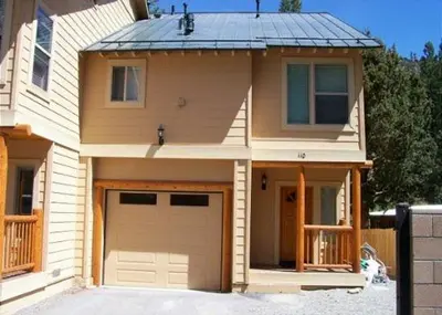 a house with a garage and a roof at Rr-hideaway_down_canyon110 in June Lake