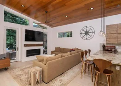 a living room with a couch and a table at Palisades Tahoe Mountain Oasis in Olympic Valley