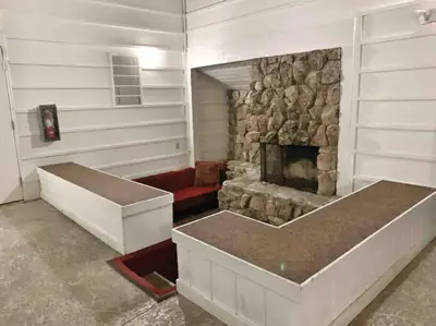 a living room with a stone fireplace and a couch at BEST Location . Walk To Canyon Lodge . Views . Pool/Spa in Mammoth Lakes